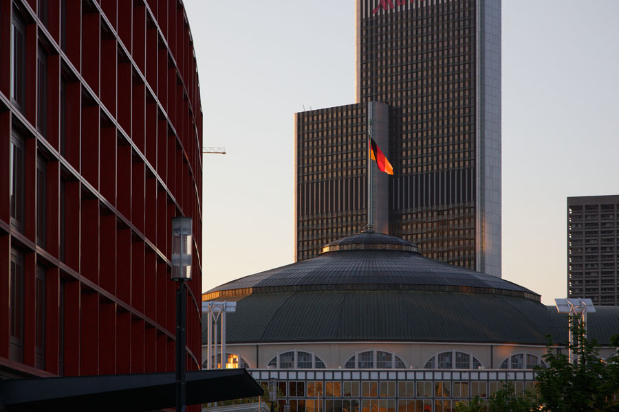 Germany flag on top of the Festhalle in Frankfurt / Main in sunset light